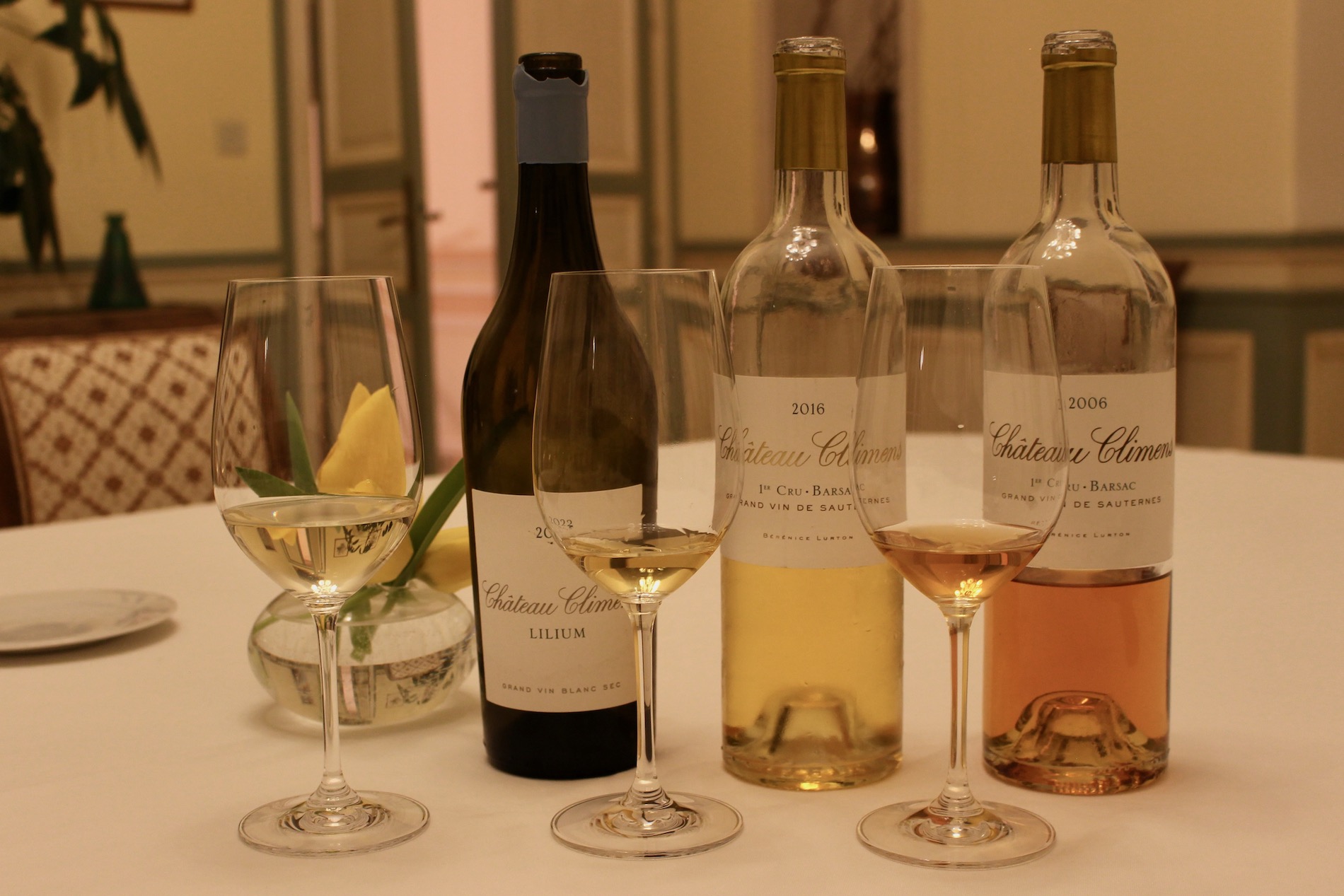 Bottles of dry and sweet wine and glasses with small pours