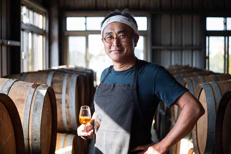 Chen Chien-hao holding a glass of fortified wine