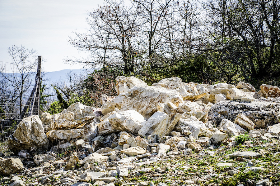 Large pile of white and brownish rock