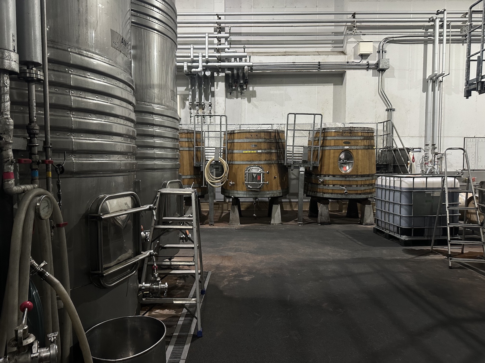 Various winemaking vessels in a large room