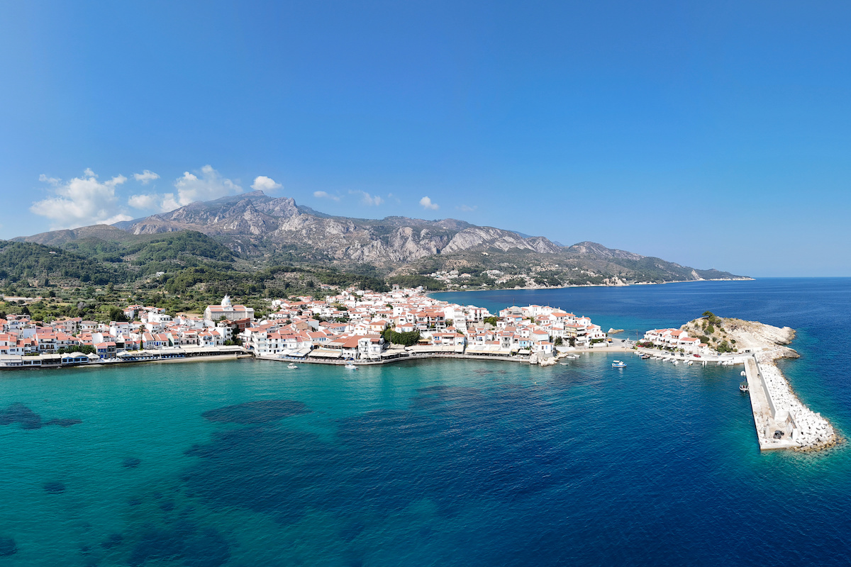 Vibrantly colored island surrounded by deep blue water
