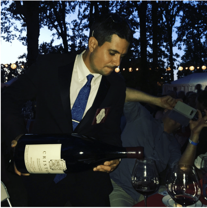 Side profile of man pouring wine