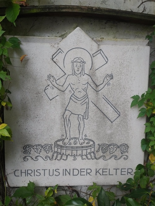 An example of “Christ in the wine-press,” on a wall in Bernkastel, Mosel (Photo credit: Rod Phillips)