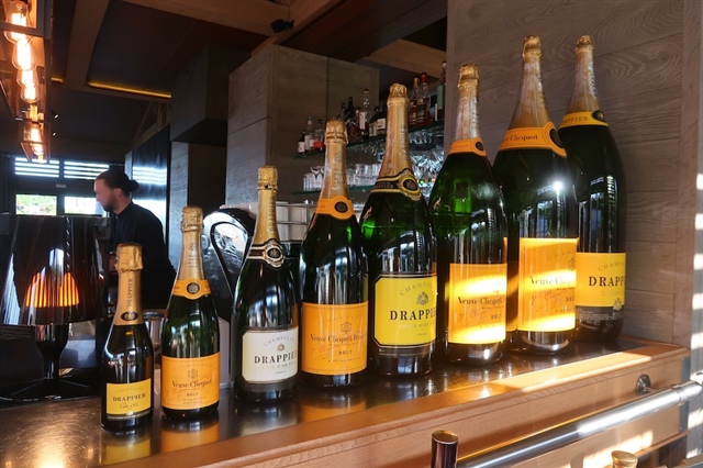 Bottles of varying sizes at bar